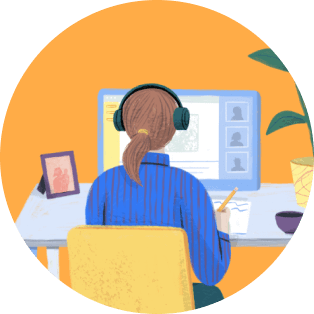 A person with headphones on a computer.